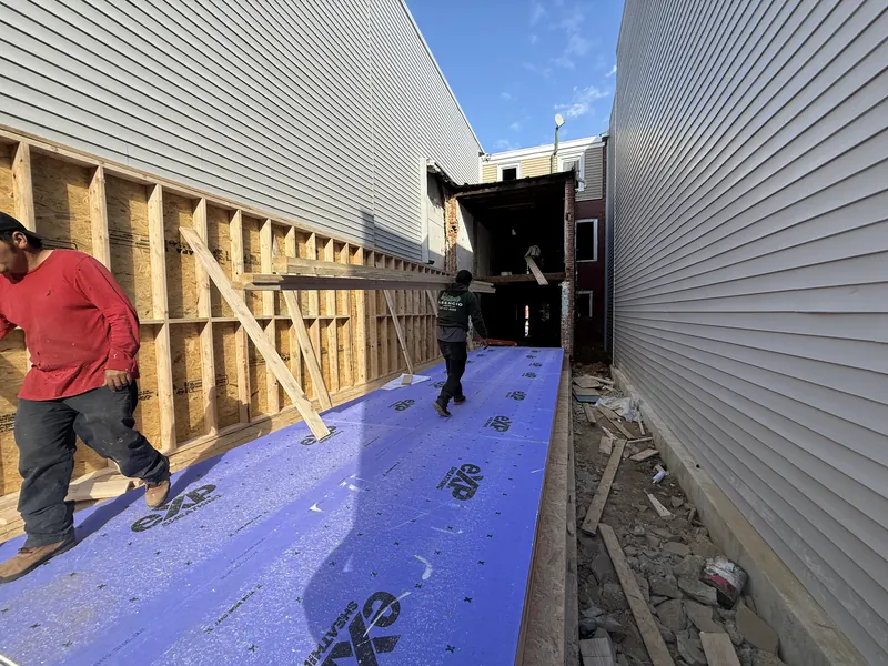 New walls and floor sheathing above the Golden Brick addition foundation